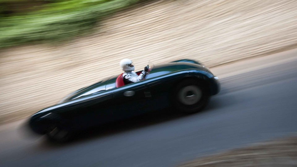 The Aero Alfa in superb motion blur past Goodwood's flint wall: by Scott Dennis